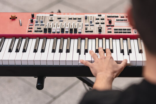Street musician playing keyboard in outdoor concert
