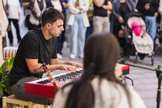 Street pianist performs live at outdoor concert