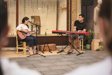 Street musicians performing live in an outdoor setting