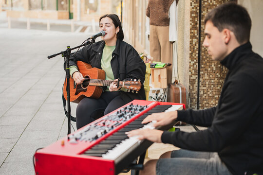Street musicians performing live concert with passion