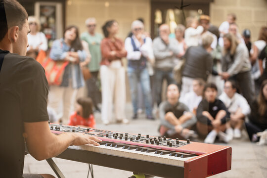 Street musician playing keyboard at outdoor concert