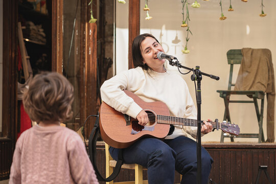 Street musician performing live outdoor concert