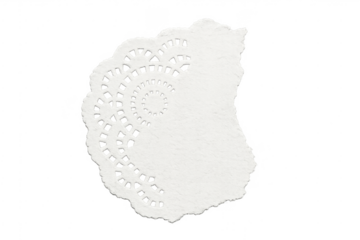 Torn white paper doily piece with transparent background