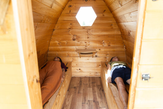 Relaxation inside a natural wooden bee sauna