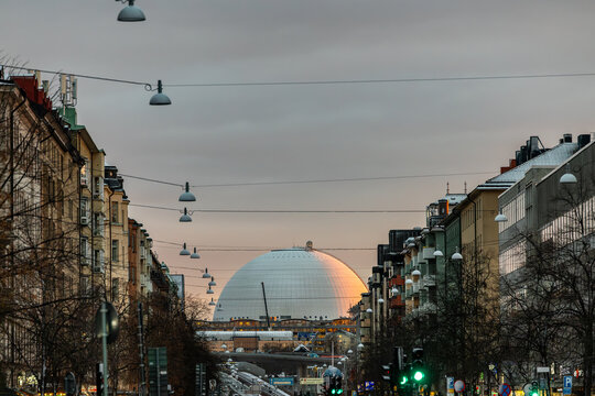 Stockholm, Sweden A view of the Globen Arena, or Ericsson Globe, at sunset along Gotgatan in the Sodermalm district.