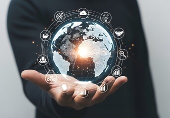 A hand holding a digital globe surrounded by icons representing global connectivity and technology
