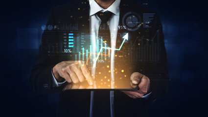 A businessman in a suit interacts with a digital tablet, showcasing financial data through dynamic graphs and charts, representing modern investment analysis and technology. Scalp