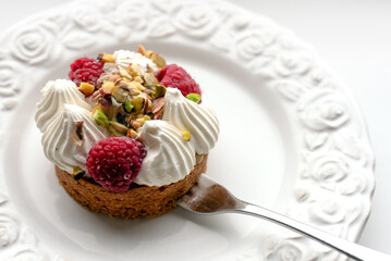 Delicious dessert with raspberries and pistachios