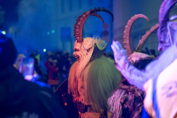 A costumed demon with horns