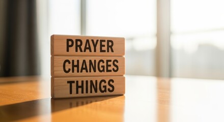 Empowering Words: Prayer Changes Things The phrase is displayed prominently on stacked wooden blocks, conveying a message of faith and transformation. 