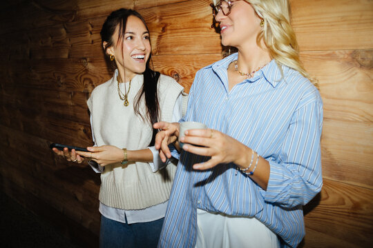 Startup cofounders laughing in casual conversation