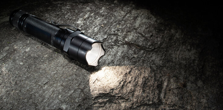 Water tight handheld flashlight