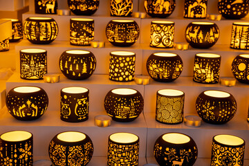 Christmas decoration with ornaments lights fir branches golden baubles red ribbons and festive details creating holiday atmosphere indoor seasonal design bright colorful winter celebration style scene