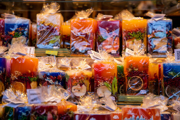 Christmas decoration with ornaments lights fir branches golden baubles red ribbons and festive details creating holiday atmosphere indoor seasonal design bright colorful winter celebration style scene