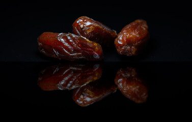 Three dates isolated on black background