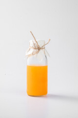 Minimal Orange Beverage Bottle on White Background
