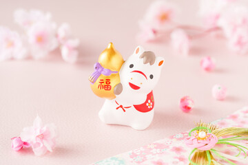 午年の年賀状素材｜金ひょうたんを抱える馬と桜