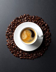 Obraz premium Overhead shot of espresso in a white cup and saucer surrounded by beans