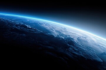A vibrant blue planet from space, showing atmospheric layers and illuminated horizon