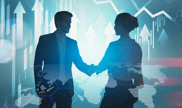 Two business people shaking hands, silhouettes with digital graphics overlay, on a blue background, concept of global partnership and financial growth