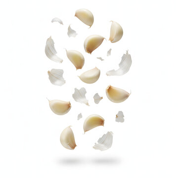 Garlic Cloves Falling with Flying Skin Isolated on White Background