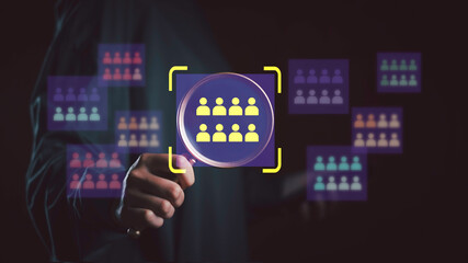 Target audience and strategy concept with hand selecting highlighted user group from multiple segments, symbolizing customer match, market trends, and business growth through digital analytics.