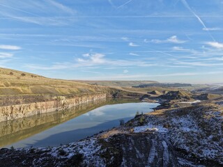 Aerial view of mountains and countryside on a cold winters day with frost and low clouds. Taken in Bury Lancashire England. 