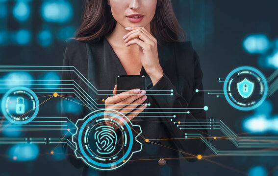 Businesswoman holding smartphone with digital fingerprint, padlock, and shield icons overlayed in futuristic interface on blue background, symbolizing cybersecurity concept