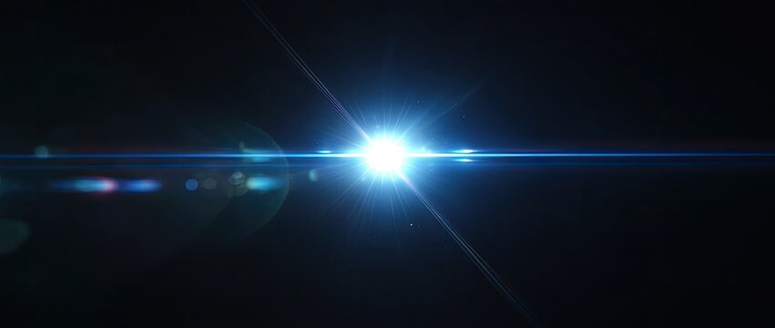 A bright, blue light flare shines against a dark background