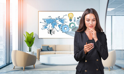 Woman in formal attire using smartphone in bright modern office, illustrated world map and tech icons on wall, concept of global communication and innovation