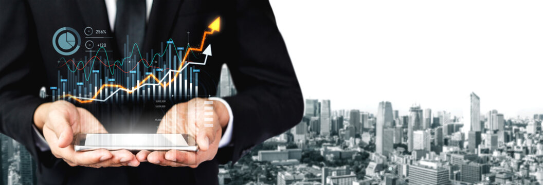 Businessman holds smartphone displaying financial growth graphics against a city skyline, symbolizing innovation and progress in today digital world. Scalp