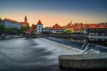 by the Vltava River at sunrise