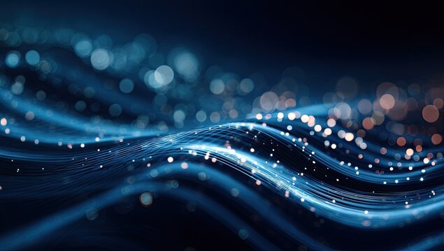 A flowing, abstract composition of bright blue and gold light particles against a dark background