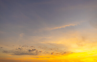 Orange sky and clouds in a bright morning,Orange clouds and morning sky,Real majestic sunrise sundown sky background with gentle colorful clouds without birds. Panoramic, big size.