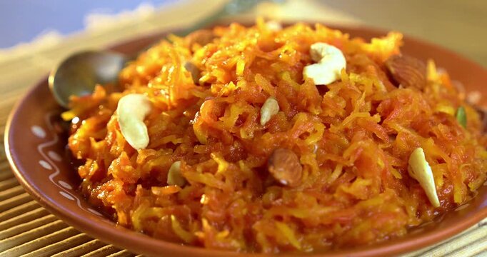Gajar Halwa Served in Bowl &ndash; Traditional Indian Carrot Dessert Garnished for Festive Celebration