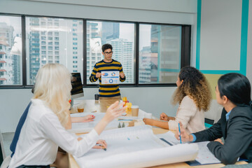 Diverse group business presentation in office. Data-driven decis