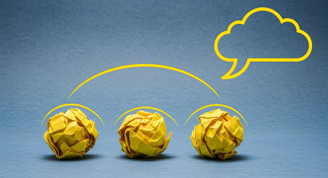 Yellow crumpled paper balls connected to a speech bubble represent brainstorming ideas and creative thinking on a blue background symbolizing innovation and problemsolving processes