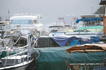 Fototapeta premium Crowded Marina with Numerous Boats and Tarps