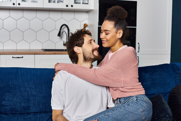 Cozy moments shared between a young couple in their warm home space