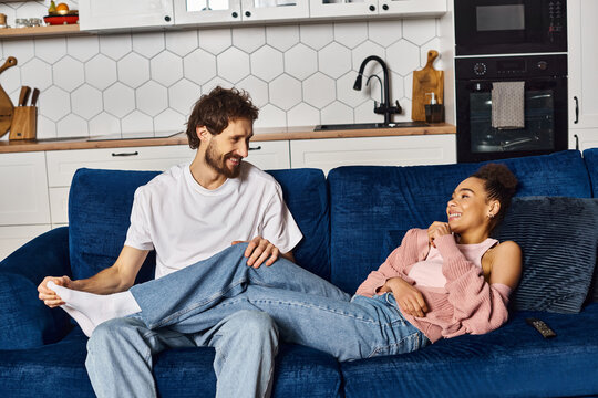 Cozy moments at home with a young couple enjoying each others company and laughter - Powered by Adobe