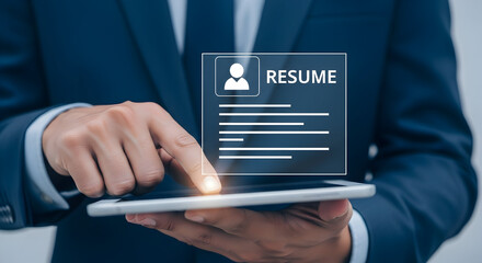 Businessman reviewing a digital resume on a tablet showcasing job search career opportunities and online applications in the modern digital age for recruitment and hiring processes