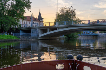 view of bridges and buildings in Ceske Budejovice from boat on the Vltava