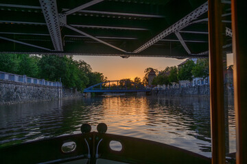 view of bridges and buildings in Ceske Budejovice from boat on the Vltava