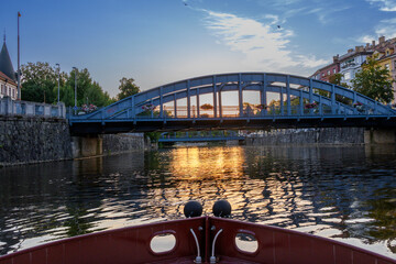 view of bridges and buildings in Ceske Budejovice from boat on the Vltava