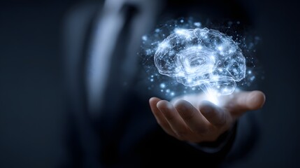 Businessman holding glowing brain hologram, representing artificial intelligence and innovative thinking.