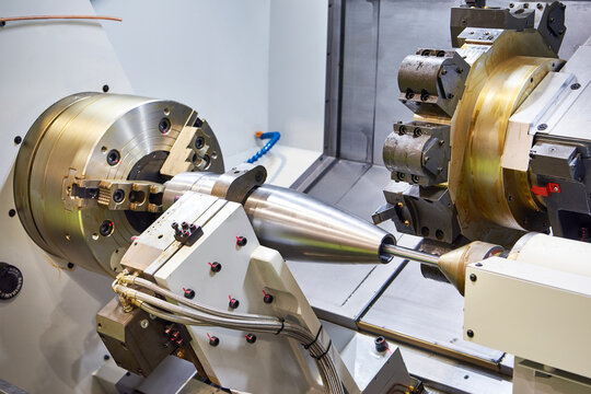Metal projectile shell on a lathe machine