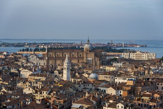View over the roofs of Venice to the church Basilica dei Santi Giovanni e Paolo in the evening light, view from the bell tower Campanile di San Marco, city view of Venice, Veneto, Italy