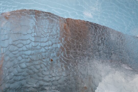 Glacier ice shimmering in various shades of blue near the edge of Negribreen, Stjorfjord, Spitsbergen Island, Svalbard and Jan Mayen archipelago, Norway