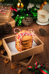 Handmade cookies wrapped with festive rope, capturing the spirit of Christmas and New Year  perfect as heartfelt gift in cozy vertical holiday photo concept.