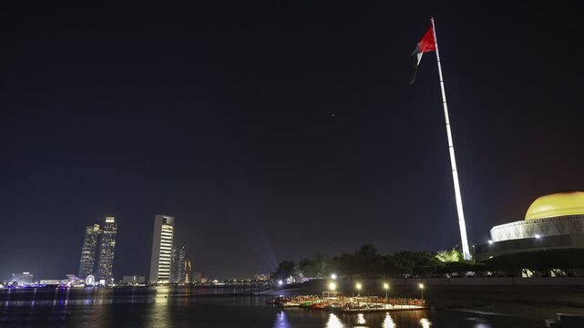 night time illumination abu dhabi city famous downtown front bay flag place panorama timelapse 4k united arab emirates   